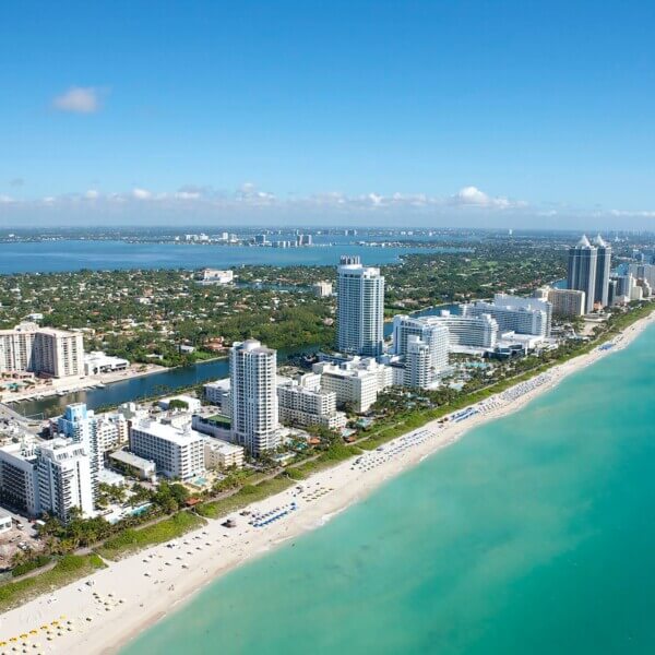 aerial view of city buildings in Miami Beach near body of water during daytime