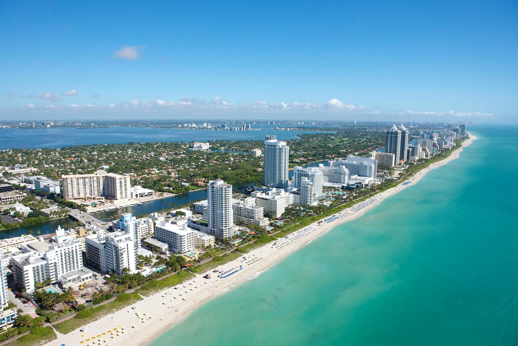 aerial view of city buildings in Miami Beach near body of water during daytime